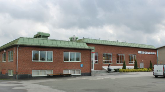 Rött tegelhus med texten medborgarhus